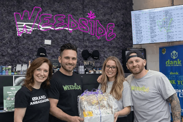 Brand ambassadors with gift basket at Weedside dispensary