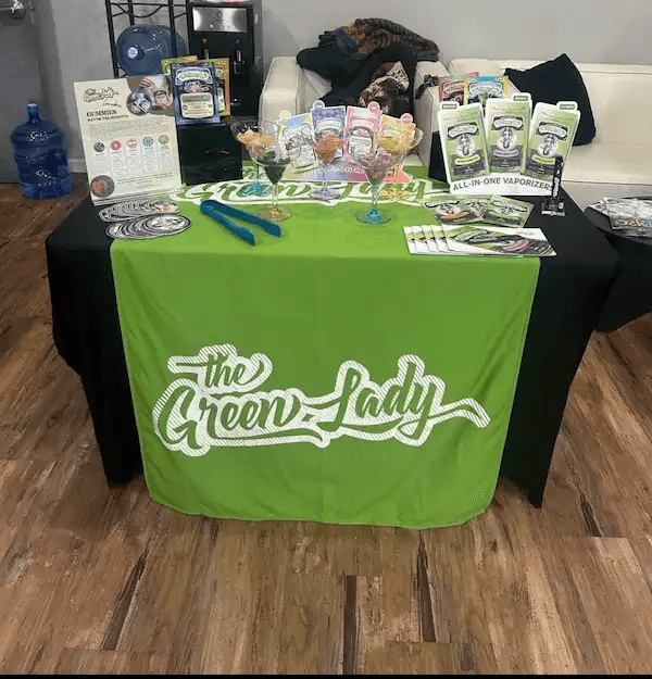 Cannabis brand activation table setup with product samples